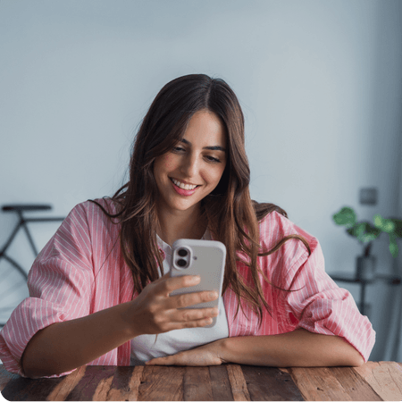 Lady holding a mobile phone looking at test results