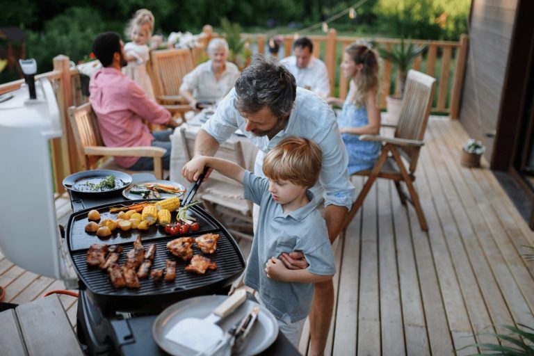 Father and son cooking a BBQ