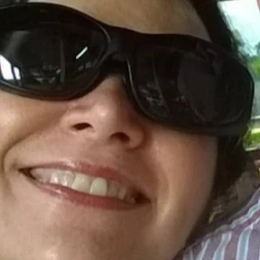 woman wearing glasses and smiling