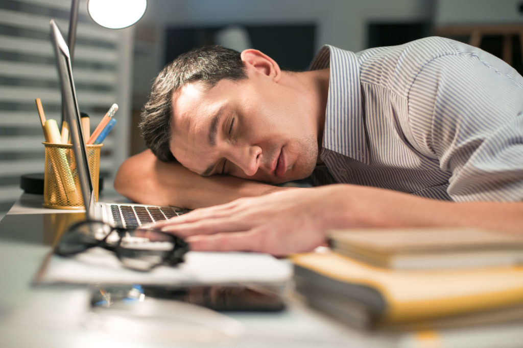 Man sleeping at desk