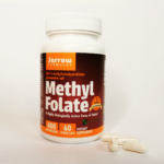 Small white container of Methyl Folate vegetable capsules