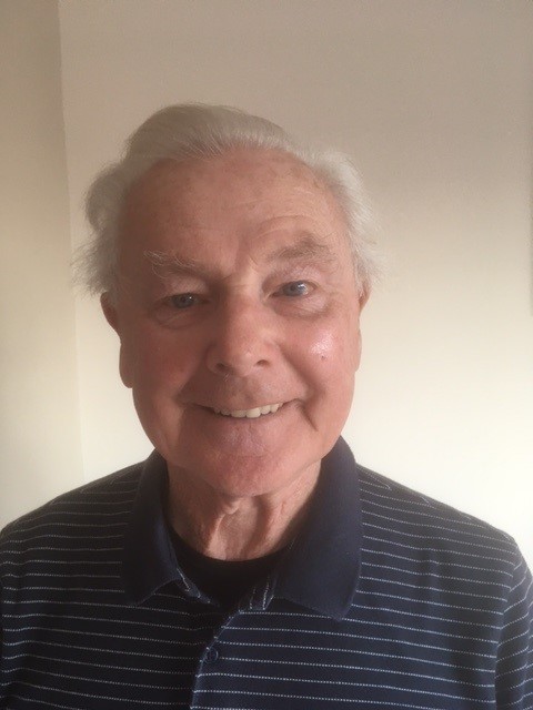 Alan Colyer, a senior YorkTest customer smiling at the camera against a light background