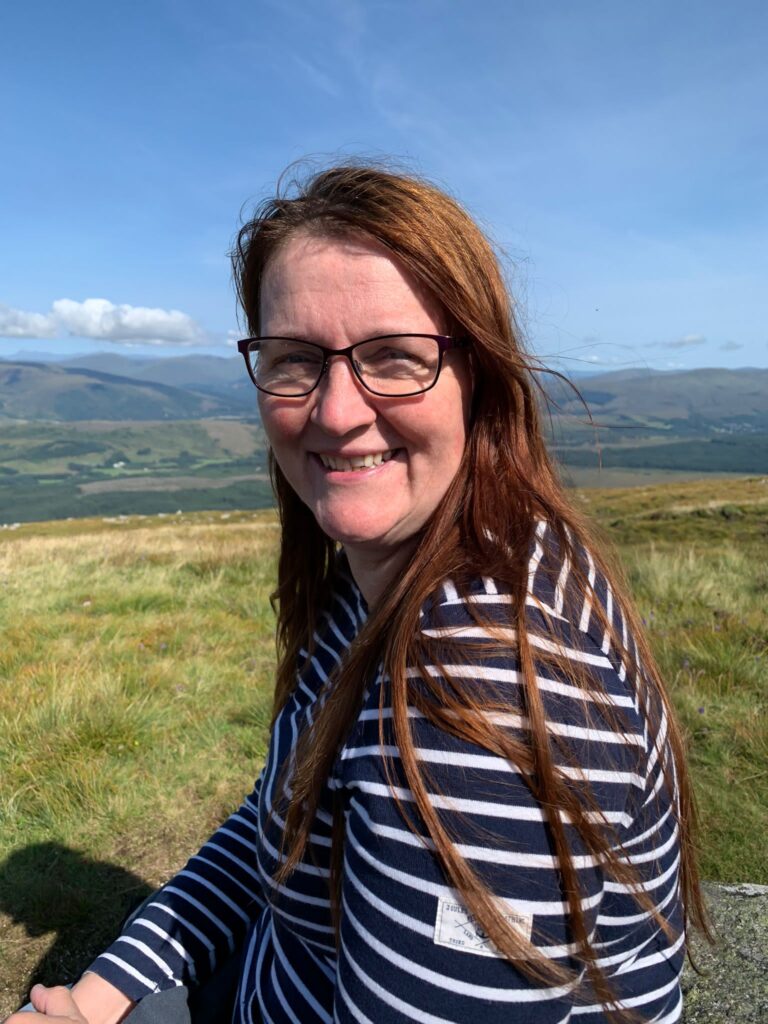 Trudi Stamp, Yorktest customer, posing in a nature setting