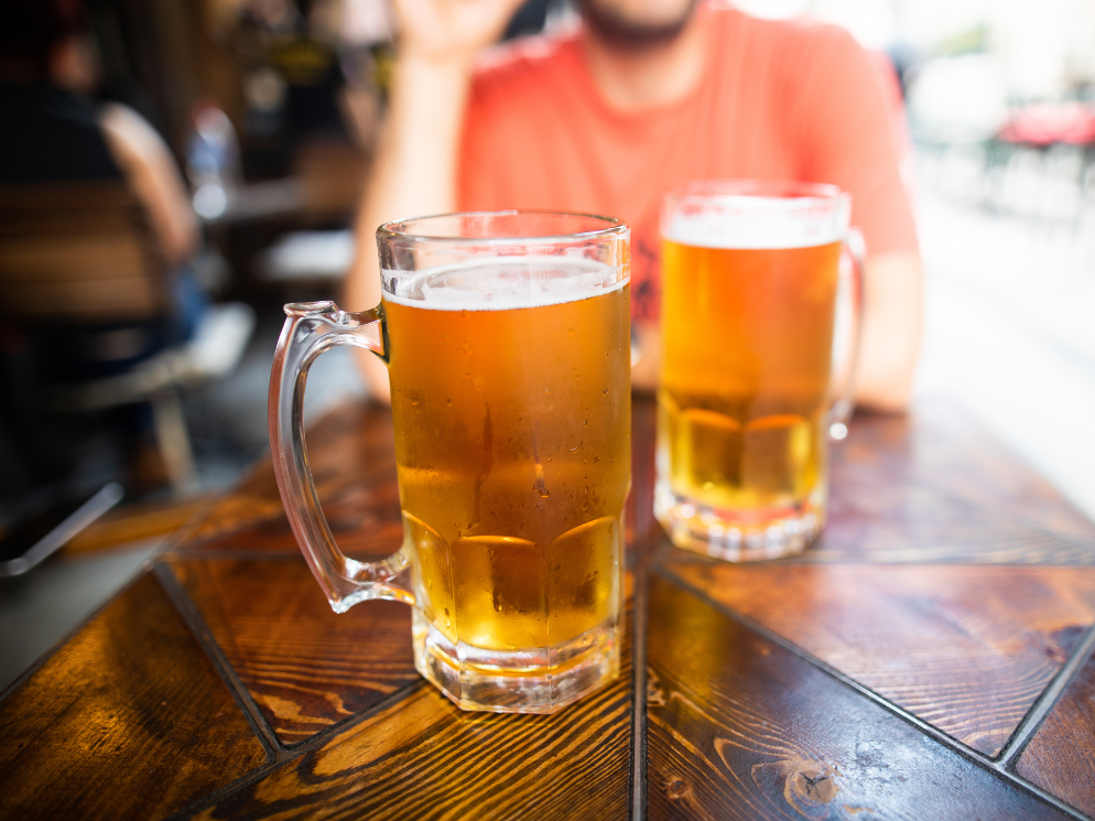 Two beer glasses on a table