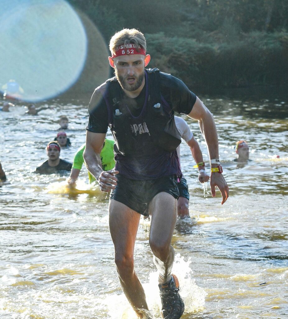 ultra marathon runner running out of the water