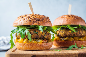 vegan burgers on a wooden tray