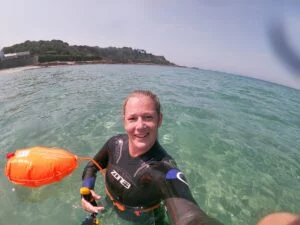 aquatics tutor posing for a selfie in the turquoise coloured sea.