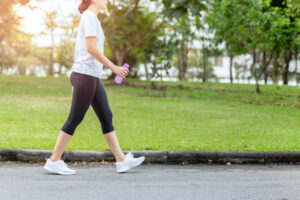 Woman walking to boost her mental health