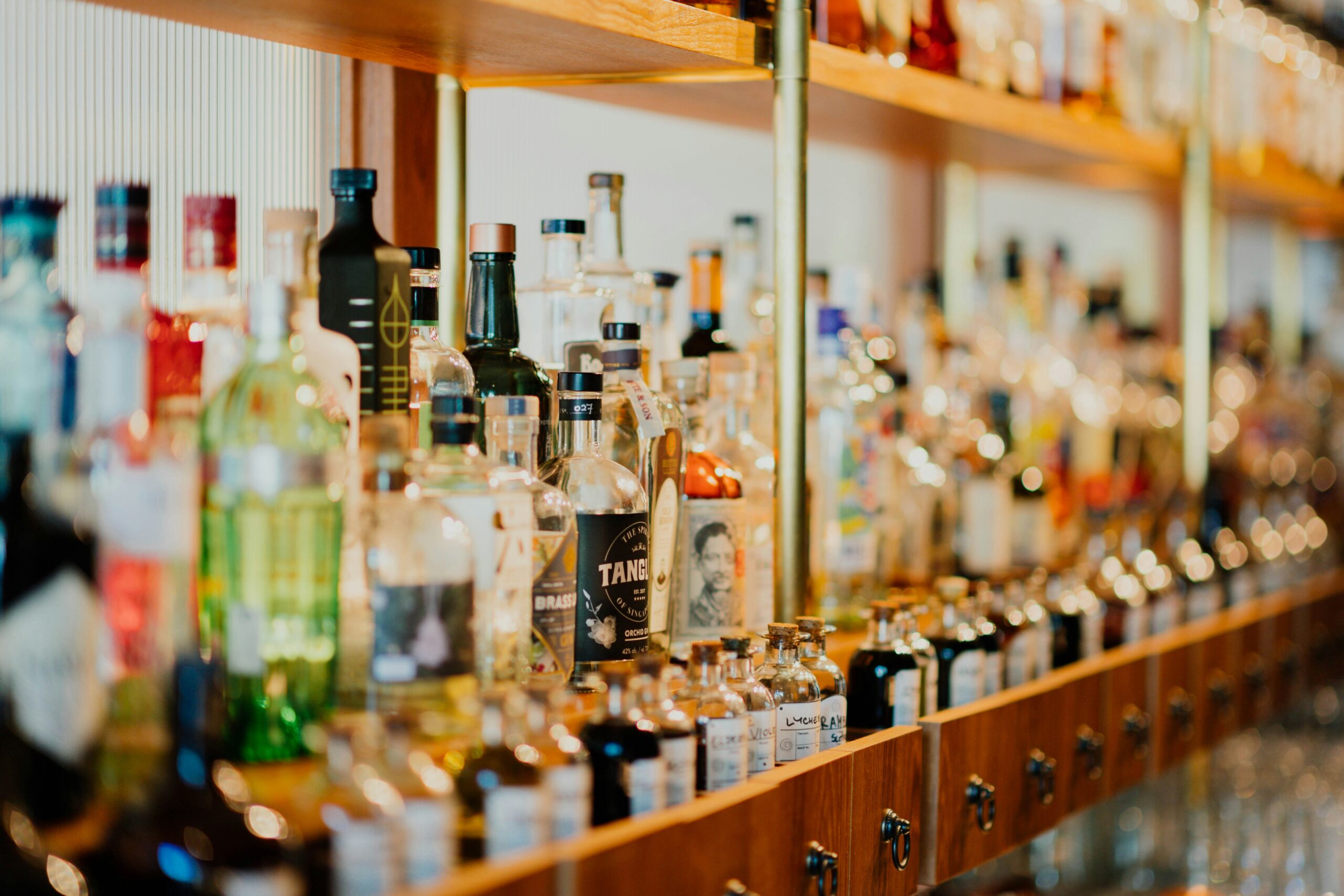 Bottles of alcohol behind the counter at a pub